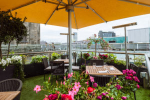 tables at bar terrace with leeds city centre view