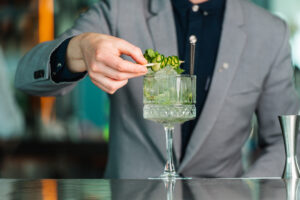 bartender decorating cocktail
